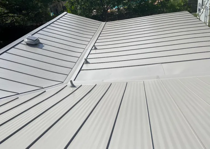 Solar attic fan installed on a metal roof for Roof Ventilation in Santa Monica